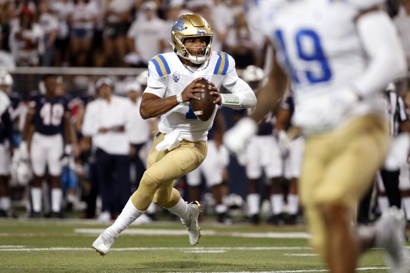 UCLA quarterback Dorian Thompson-Robinson (1) runs with the ball against Arizona 