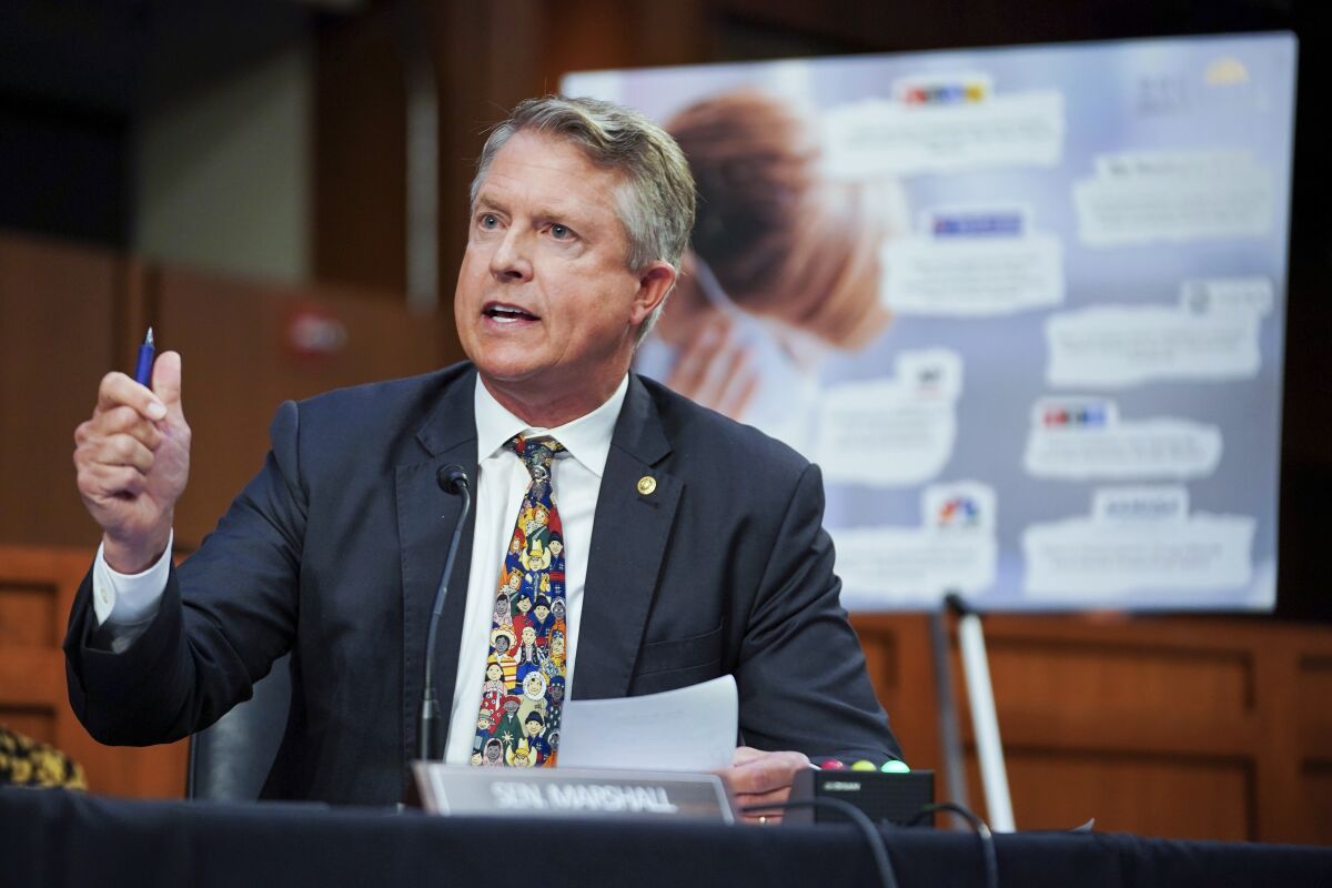 FILE - In this Sept. 20, 2021, file photo, Sen. Roger Marshall, R-Kan., speaks during a Senate Health, Education, Labor, and Pensions Committee hearing to discuss reopening schools during the COVID-19 pandemic on Capitol Hill in Washington. Marshall won't let people forget he's a doctor by putting "Doc" in the letterhead of his U.S. Senate office news releases. But when it comes to COVID-19 vaccines, other doctors think he sounds far less like a doctor and far more like a politician rallying hard-right supporters. (Greg Nash/Pool via AP, File)