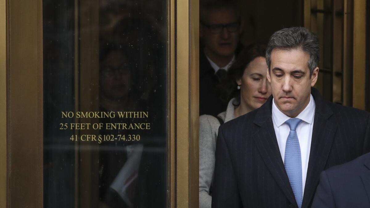 Michael Cohen, President Trump’s former lawyer, exits federal court after his sentencing hearing Thursday in New York City.