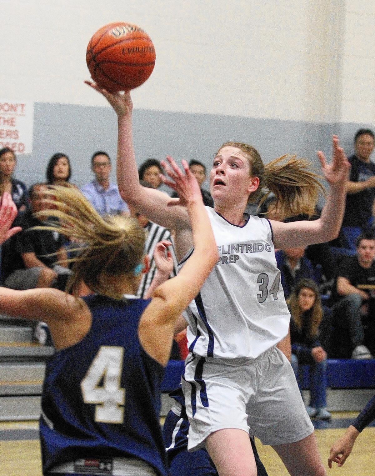 File Photo: Flintridge Prep's Tala Ismail leans in for a shot against Mission Prep in a SS Division IV-A first-round playoff girls basketball game at Flintridge Prep in La Cañada Flintridge on Thursday, Feb. 20, 2014. Tala Ismail, along with teammate Lacy Coan, earned spots on the Prep League first team.