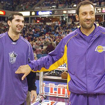 Los Angeles Lakers center Vlade Divac with Sacramento Kings forward Peja Stojakovic during pregame warmups in 2004. Divac, who played six years with the Kings, made his first appearance as a Laker since leaving the Kings prior to the 2004-05 season.