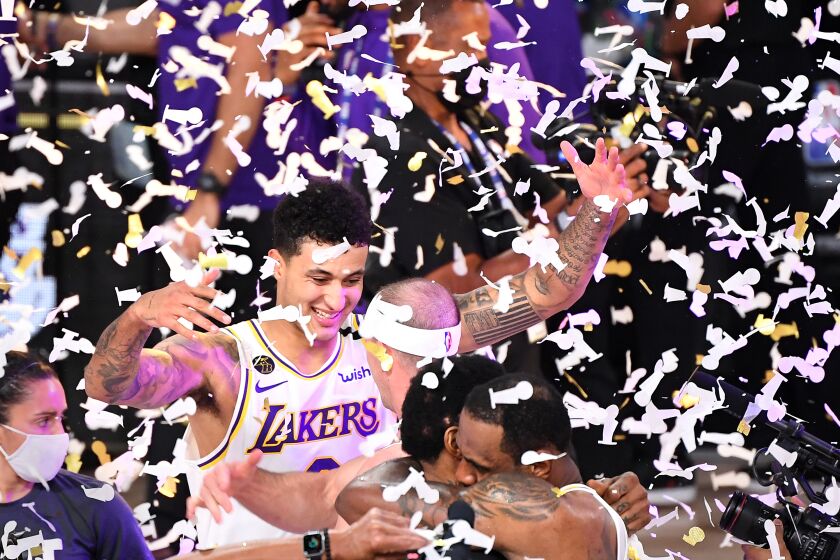 ORLANDO, FLORIDA OCTOBER 11, 2020- Lakers Kyle Kuzma celebrates the NBA Championship in Game 6 of the NBA FInals in Orlando Sunday. (Wally Skalij/Los Angeles Times)
