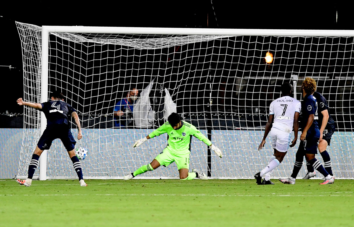 Minnesota United's Kevin Molino (7) scores the winning goal in stoppage time against Sporting Kansas City on Sunday.