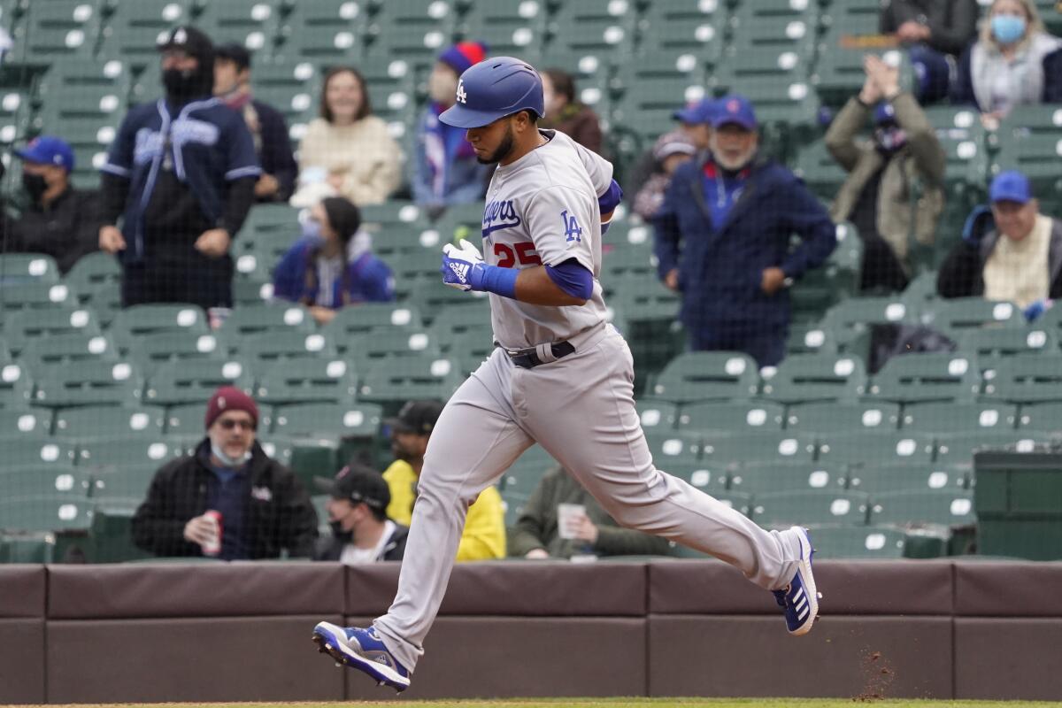 Los Angeles Dodgers Keibert Ruiz runs the bases after hitting a home run against the Chicago Cubs.