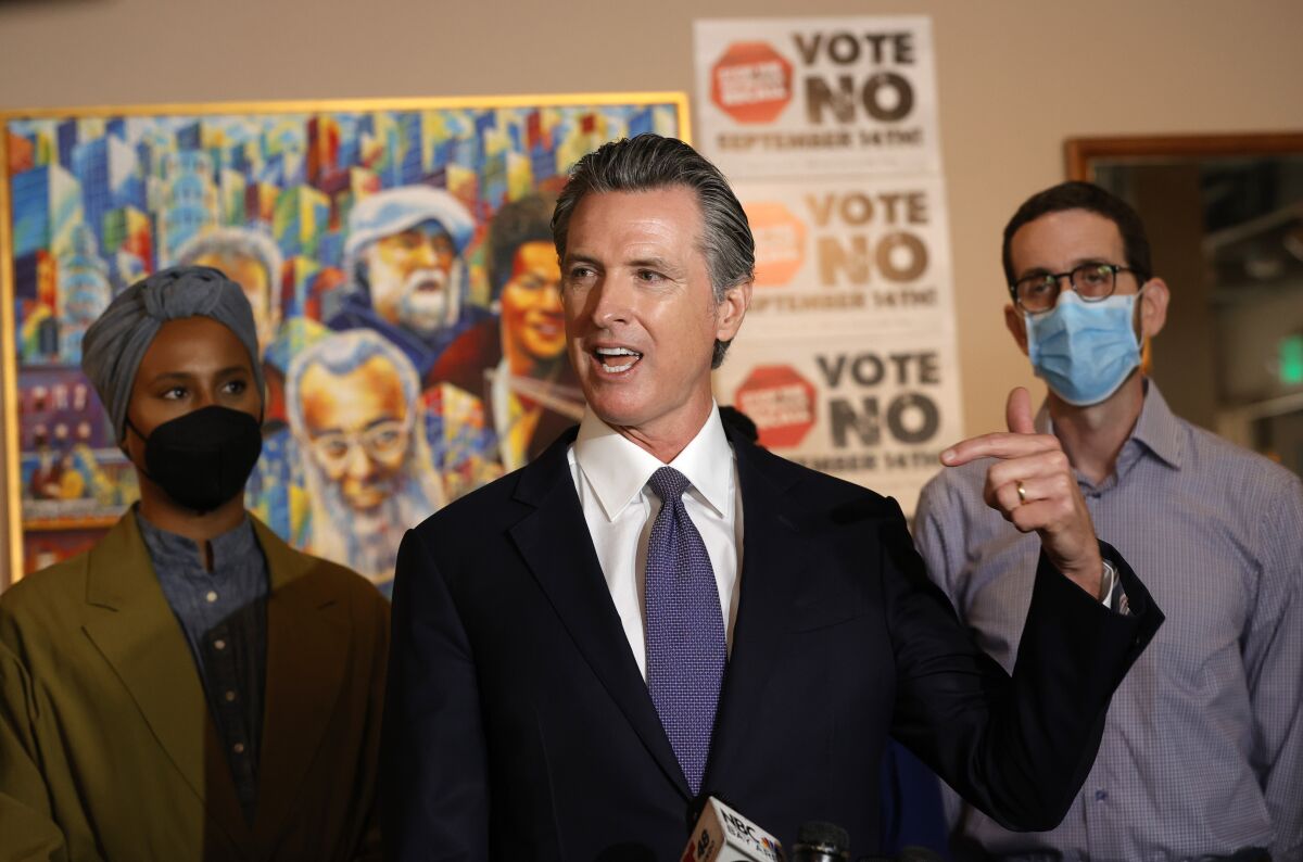Gov. Gavin Newsom speaks about the recall at a cafe in San Francisco in mid-August.