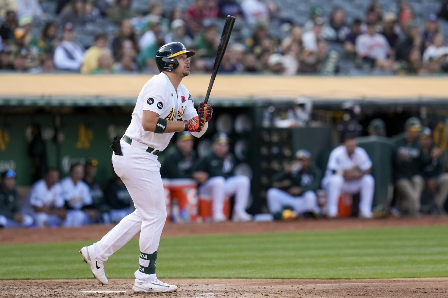 Ryan Noda of the Oakland Athletics high fives Shea Langeliers