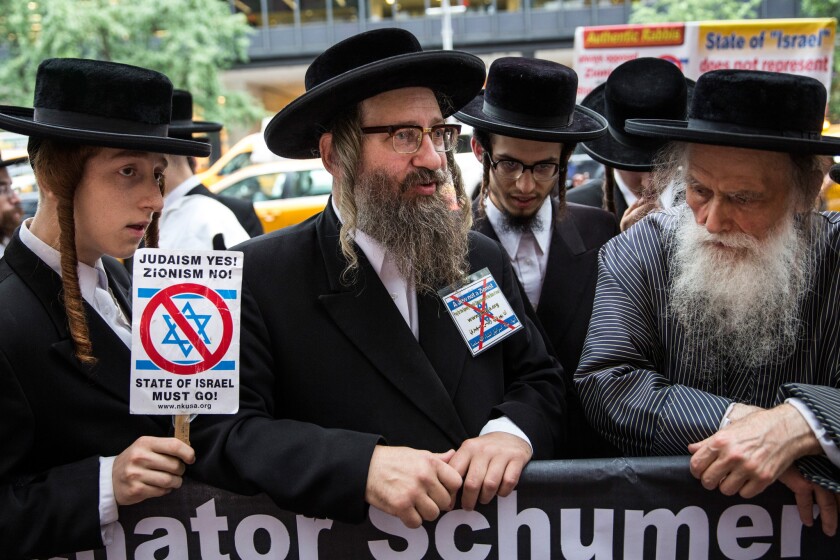 Anti-Zionist Orthodox Jews protest outside U.S. Sen. Chuck Schumer's Manhattan offices this month over his decision not to support President Obama's Iranian nuclear deal.
