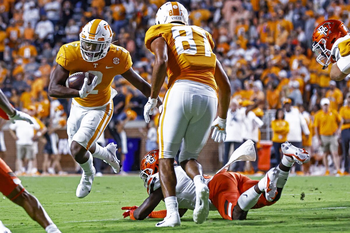 Tennessee running back Jabari Small (2) avoids a Bowling Green defender during the first half of an NCAA college football game Thursday, Sept. 2, 2021, in Knoxville, Tenn. (AP Photo/Wade Payne)