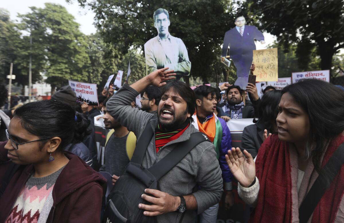 Students in New Delhi shout antigovernment slogans during a protest Tuesday against a new citizenship law. 
