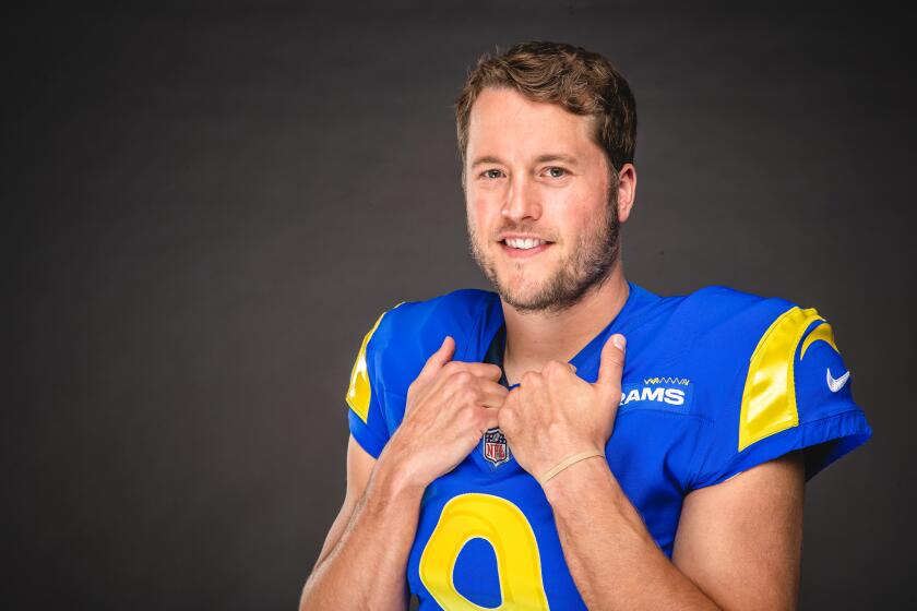 Quarterback Matthew Stafford (9) poses for a photo in his Rams uniform.