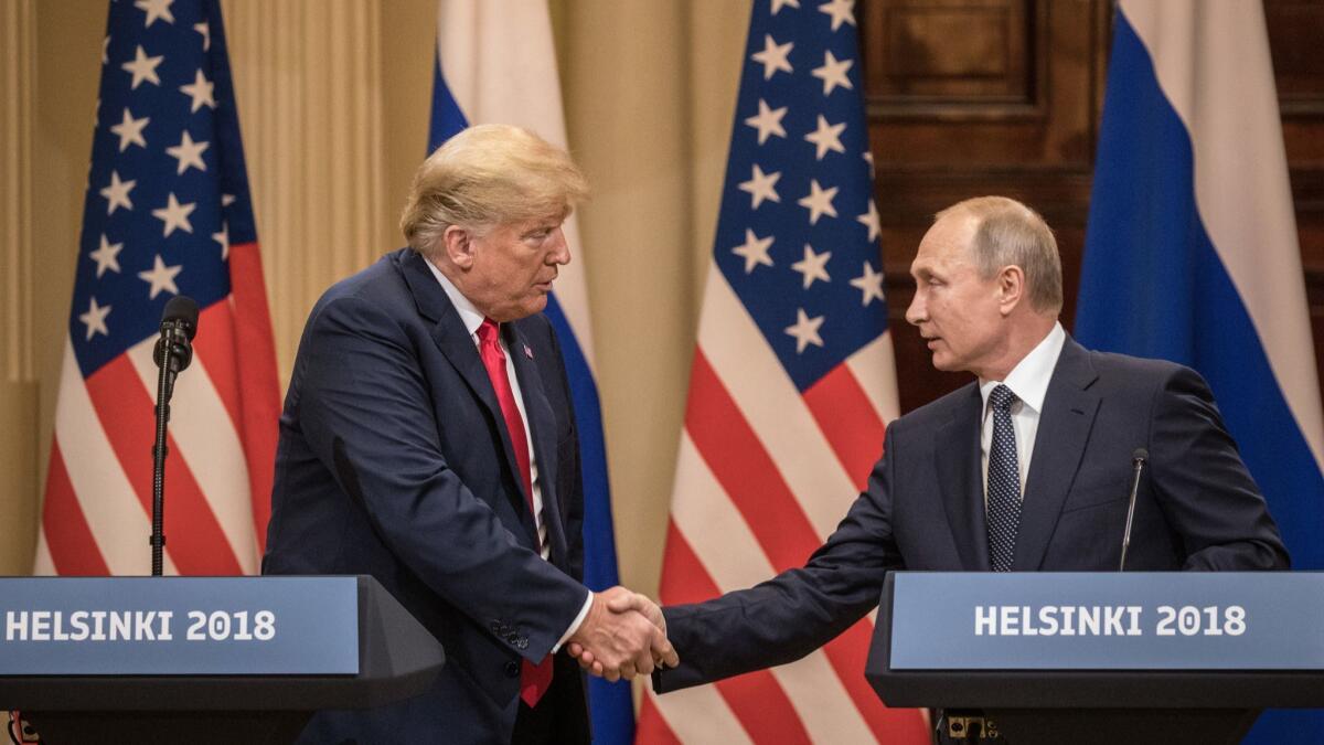 President Donald Trump and Russian President Vladimir Putin shake hands during a joint press conference after their summit on July 16 Helsinki, Finland.