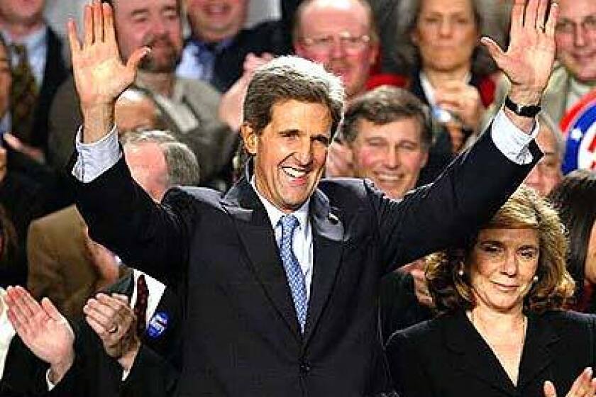 Sen. John Kerry celebrates after winning victories in five of seven states holding presidential constests on Feb. 3.