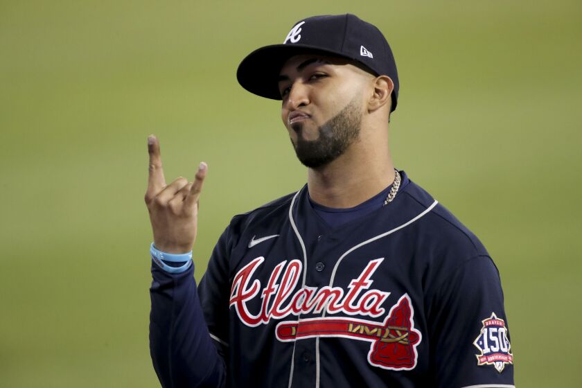Los Angeles, CA - October 20: Atlanta Braves' Eddie Rosario gestures to the fans during the ninth inning in game four in the 2021 National League Championship Series against the Los Angeles Dodgers at Dodger Stadium on Wednesday, Oct. 20, 2021 in Los Angeles, CA. (Luis Sinco / Los Angeles Times)