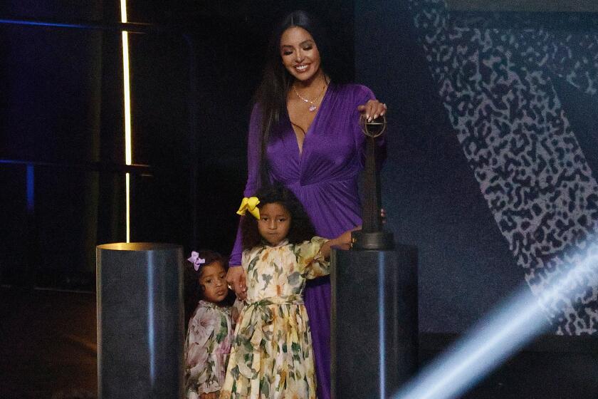 Vanessa Bryant stands with daughters Capri and Bianka after speaking on behalf Kobe on May 15, 2021.