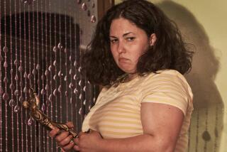 A young woman holds a metal figure in the movie "Piggy."