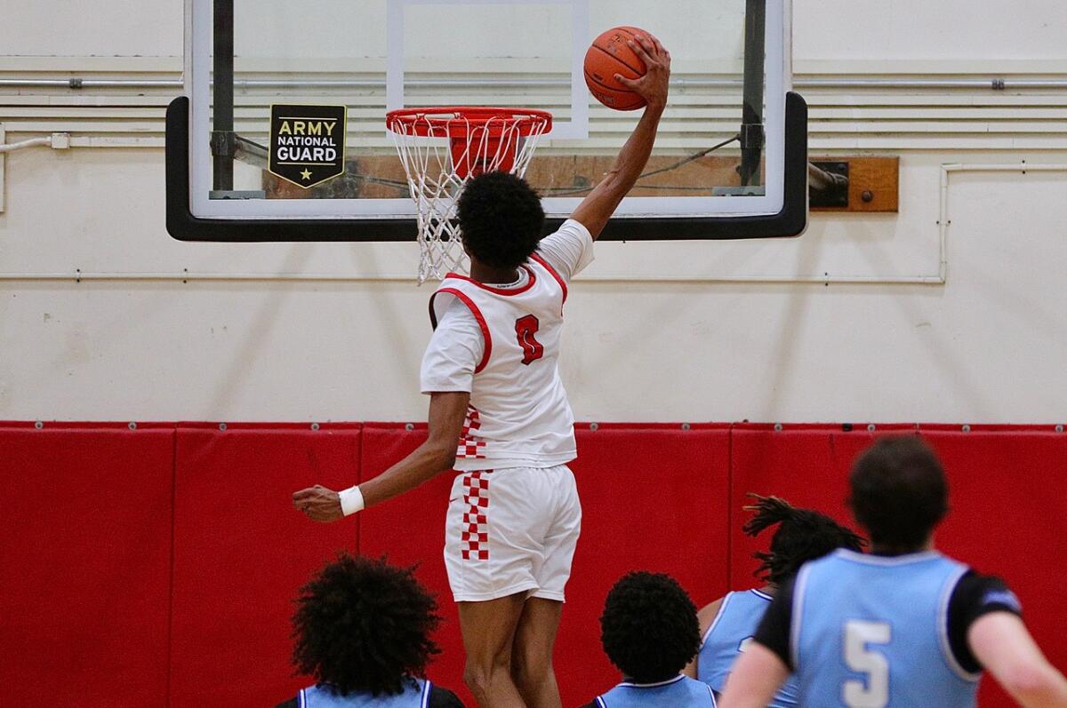 Tajh Ariza of Westchester dunks during his 22-point performance in the Comets' 59-34 win over Palisades.