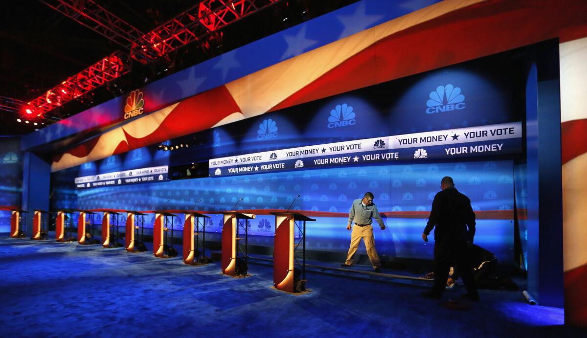 Crews prepare the venue for Wednesday's Republican presidential debate at the University of Colorado in Boulder.