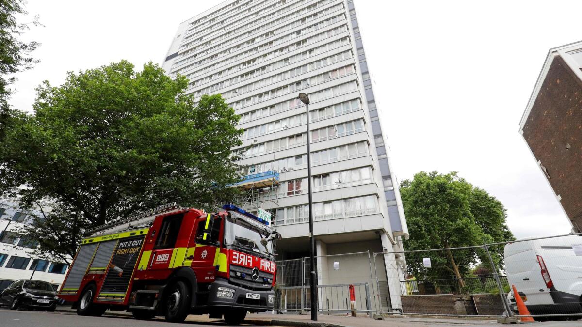 A fire engine parks outside Braithwaite House residential block in Islington in north London on June 24, 2017. Residents of 650 London flats were evacuated due to fire safety fears in the wake of the Grenfell Tower tragedy, but 83 people refused to leave their homes.