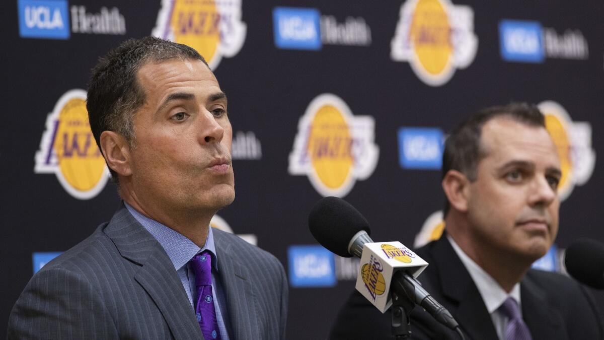 Lakers general manager Rob Pelinka, left, and head coach Frank Vogel speak with the media Monday in El Segundo.