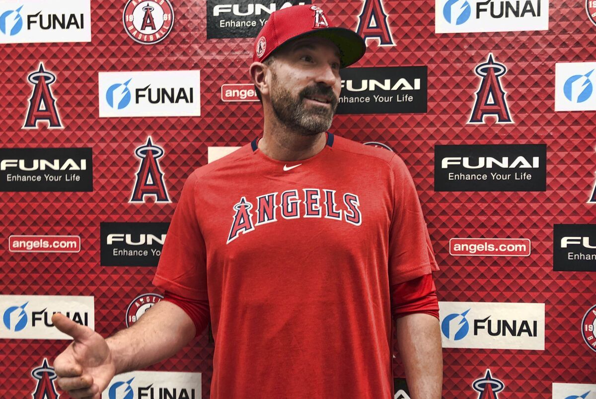 Angels pitching coach Mickey Callaway speaks to reporters.
