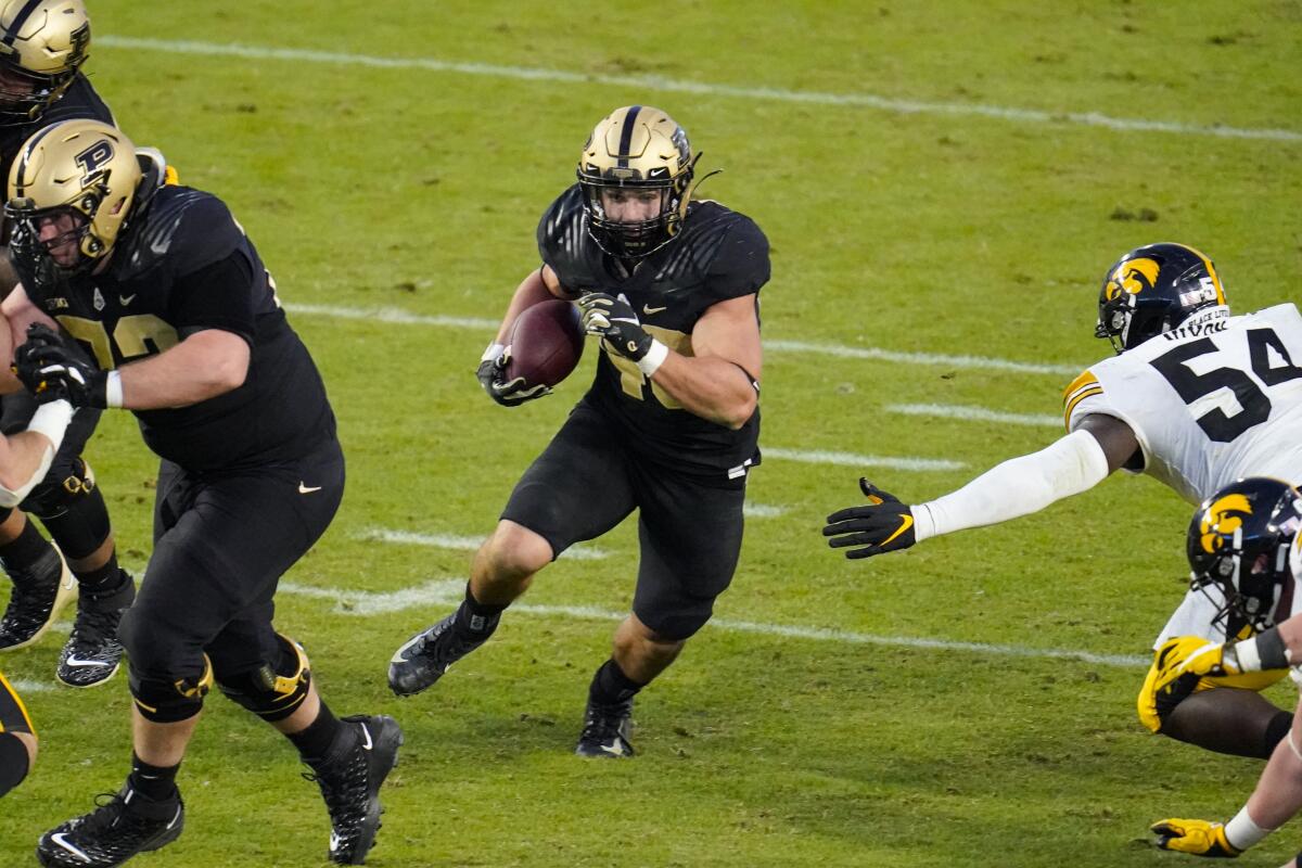 Purdue running back Zander Horvath (40) runs through the Iowa defense Saturday