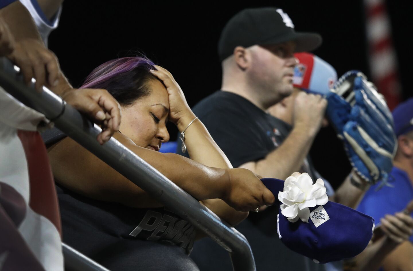 Fans at Dodger Stadium react as Houston wins a Game 2 thriller, 7-6, in 11 innings.