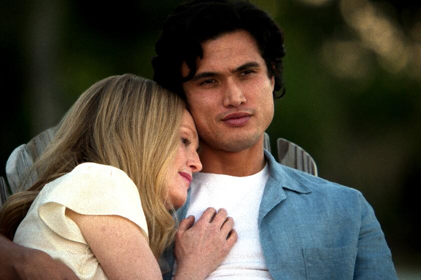 Julianne Moore as Gracie Atherton-Yoo and Charles Melton as Joe in a scene from 'May December.'