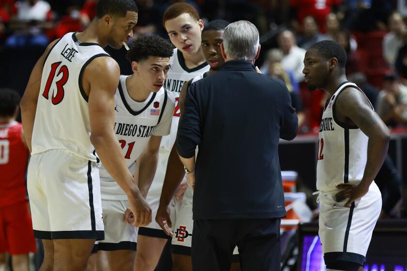Las Vegas, NV - March 16: San Diego State coach Brian Dutcher talks with his team against New Mexico during the Mountain West tournament championship on Saturday March 16, 2024 in Las Vegas, NV. (K.C. Alfred / The San Diego Union-Tribune)