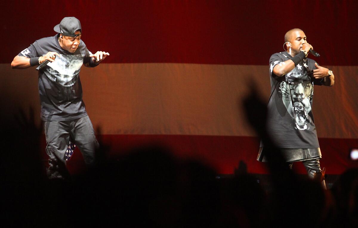 Jay-Z, left, and Kanye West perform at Staples Center in 2011 on their "Watch the Throne" tour.