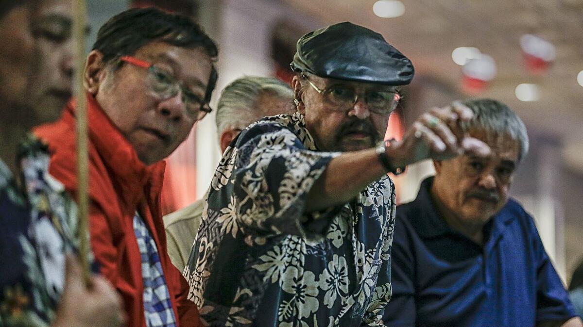 Richard Favela tosses the dice during a qualifying round at the California Hotel and Casino Golden Arm Craps Tournament.