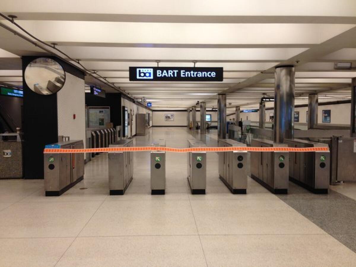 Orange tape closes off a BART entrance during Monday's strike.