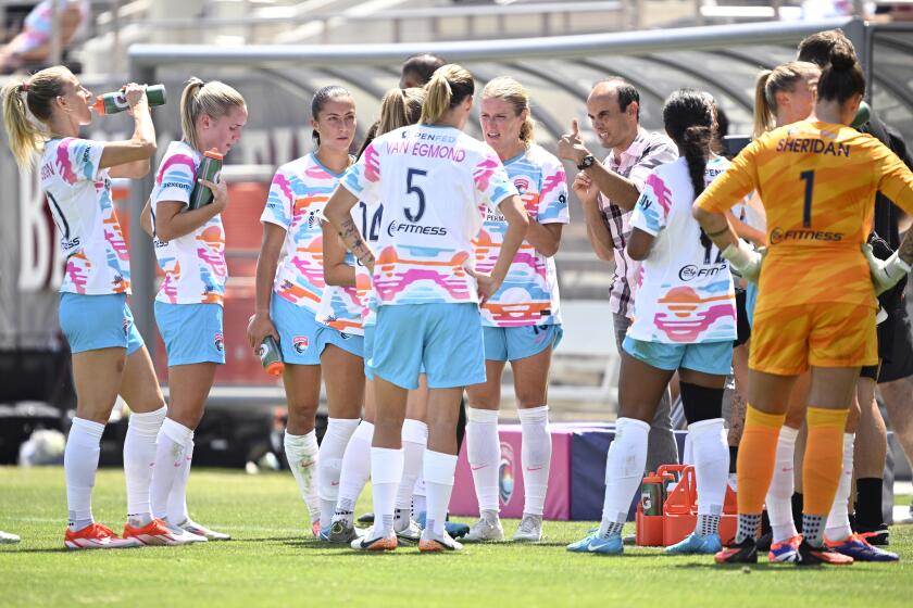 SAN DIEGO, CALIFORNIA - AUGUST 24: Landon Donovan of the San Diego Wave FC talks to Wave players during a pause in play in the first half against the Angel City FC at Snapdragon Stadium on August 24, 2024 in San Diego, California. (Photo by Orlando Ramirez/Getty Images)