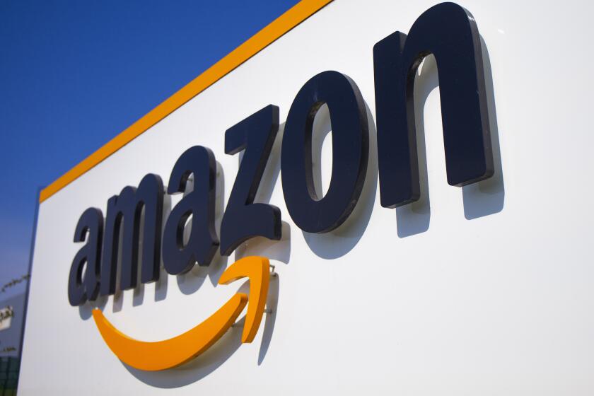 FILE - In this Thursday April 16, 2020 file photo, The Amazon logo is seen in Douai, northern France. Amazon is looking to kickstart holiday shopping early this year. The company said Monday, Sept. 28, 2020 that it will hold its annual Prime Day sales event over two days in October That's because the pandemic forced it to be postponed from July. It’s the first time the sales event is being held in the fall. (AP Photo/Michel Spingler, File)