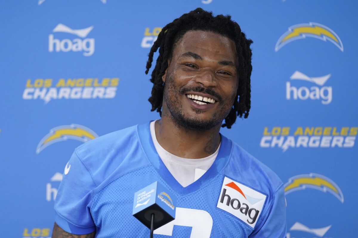 FILE - Los Angeles Chargers safety Derwin James Jr. speaks to reporters after an NFL football practice at the Chargers practice facility in Costa Mesa, Calif., Monday, May 23, 2022. Derwin James has agreed to a four-year, $76.5-million extension with the Los Angeles Chargers, making him the NFL's highest-paid safety. James is going into his fifth season and will be on the field Wednesday morning, Aug. 17, when the Chargers begin two days of joint practices with the Dallas Cowboys.(AP Photo/Ashley Landis, File)