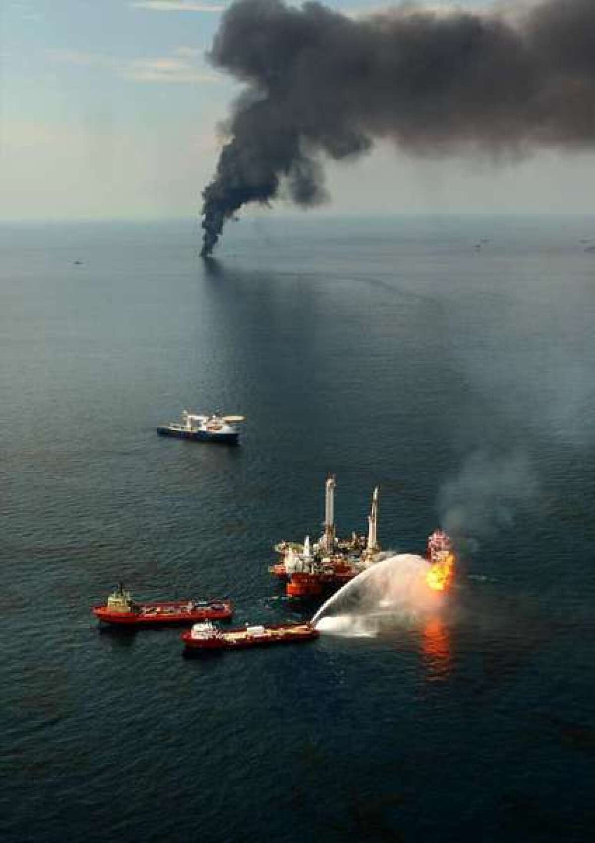 Fires burn around the site of the BP Deepwater Horizon rig site.
