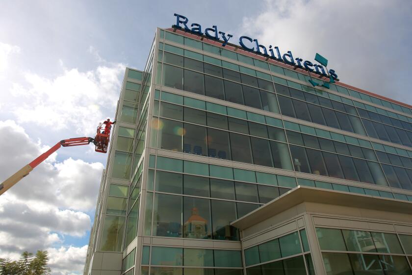 San Diego, CA. USA October 31, 2016 | Dennis Dwyer and his A+ Window Cleaning company washed away some sad little faces Monday morning by wearing superhero costumes as they cleaned the windows at Rady Children's Hospital in San Diego. | Mandatory photo credit: Peggy Peattie / San Diego Union-Tribune