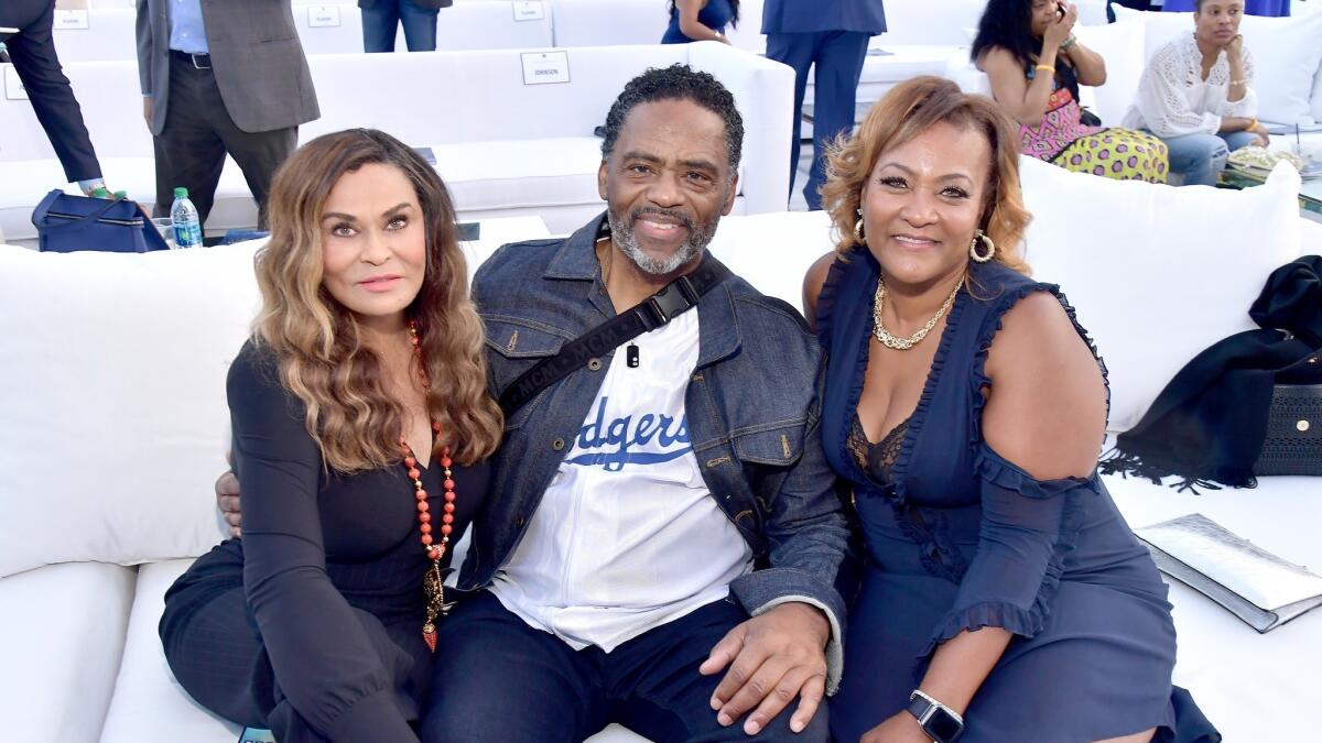 Tina Knowles Lawson, left, Richard Lawson and a gala guest.