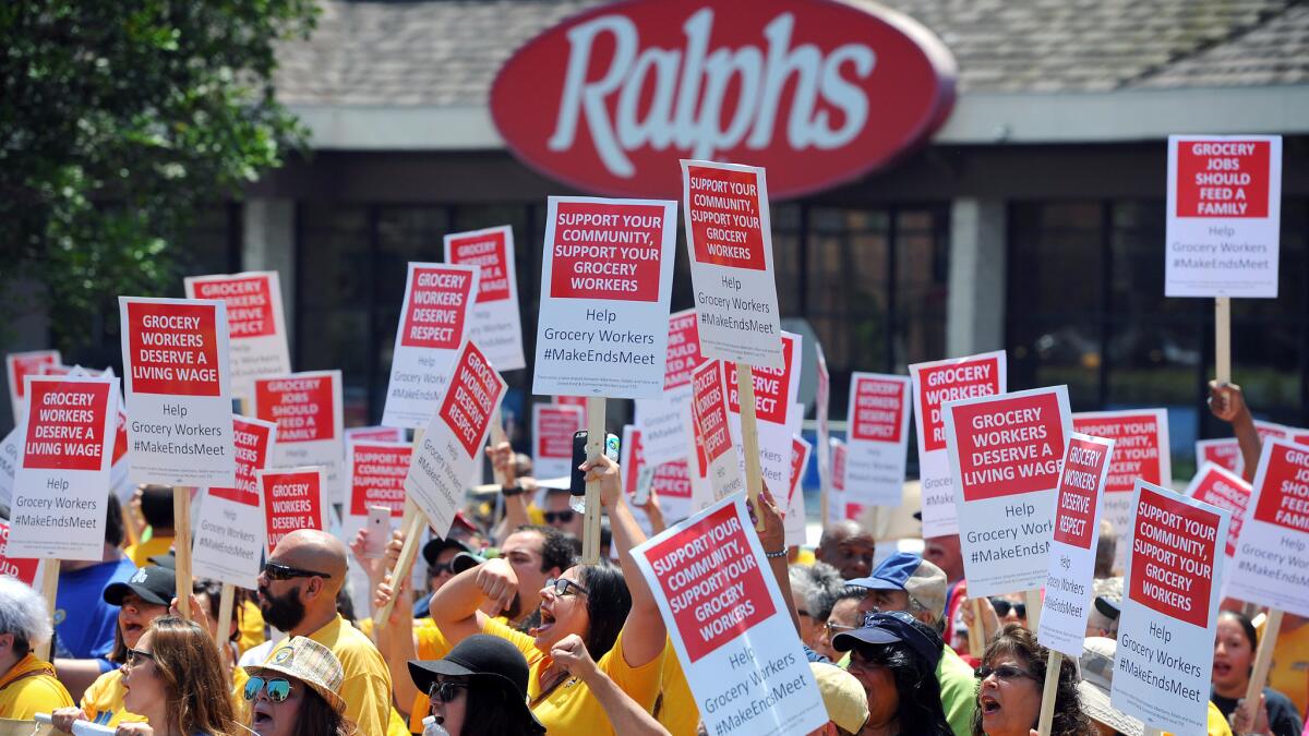 Grocery workers and supporters rally in front of grocery stores on Aug. 2 to demand a new contract.