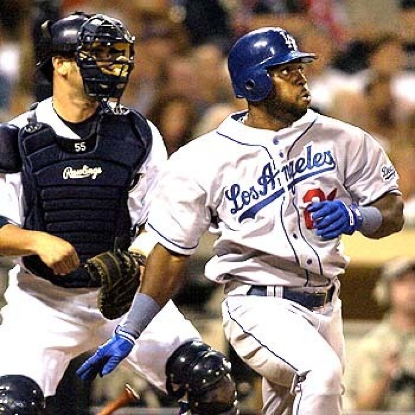 Milton Bradley hits for the Dodgers in a game against the San Diego Padres.