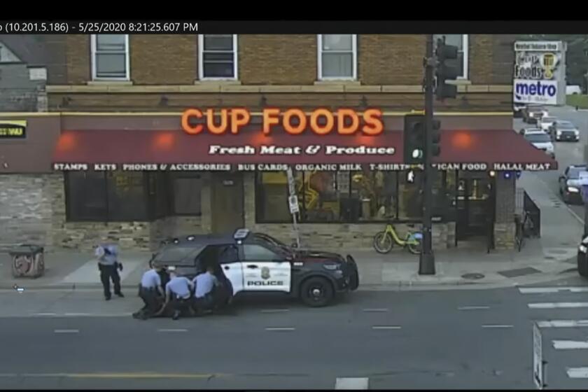 FILE - In this May 25, 2020 file image from surveillance video, Minneapolis police Officers from left, Tou Thao, Derek Chauvin, J. Alexander Kueng and Thomas Lane are seen attempting to take George Floyd into custody in Minneapolis, Minn. The video was shown as Hennepin County Judge Peter Cahill presides Monday, March 29, 2021, in the trial of former Minneapolis police officer Derek Chauvin, in the death of Floyd at the Hennepin County Courthouse in Minneapolis, Minn. (Court TV via AP, Pool, File)