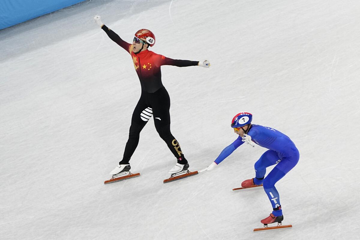 Wu Dajing skates at the 2022 Olympics.