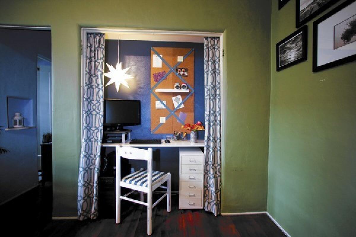 Kyle Schuneman helps turn a closet in a small 1920s apartment into an alcove work space.