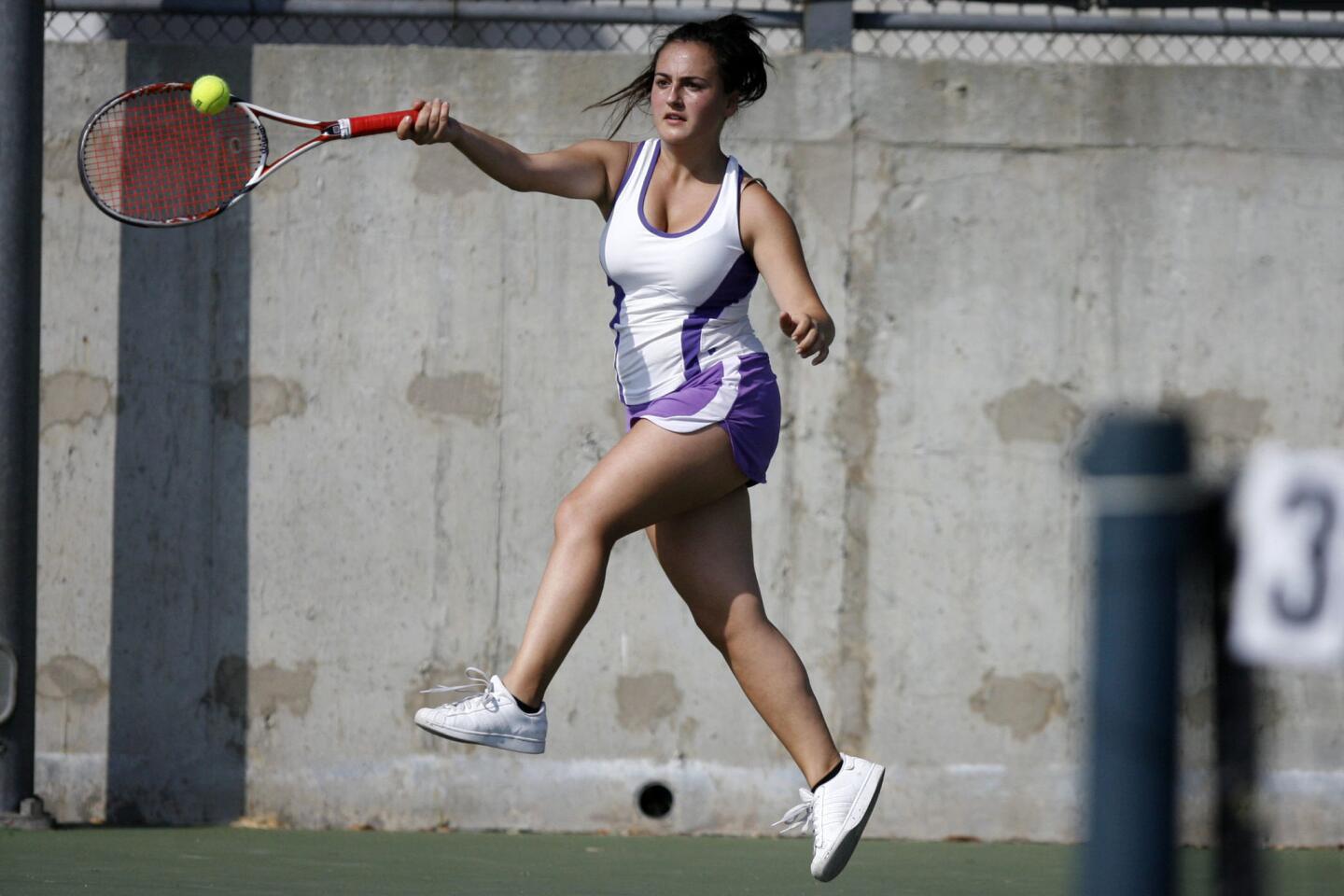 Hoover's Diana Karapetyan swings at the ball during a doubles match against Burroughs at Hoover High School in Glendale on Tuesday, September 11, 2012.