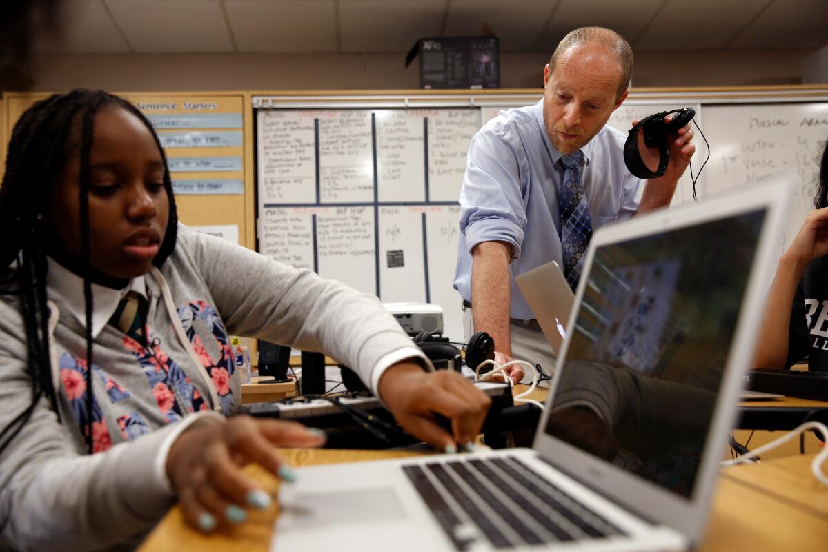 Sebastien Elkouby and a student in his hip-hop and music production class