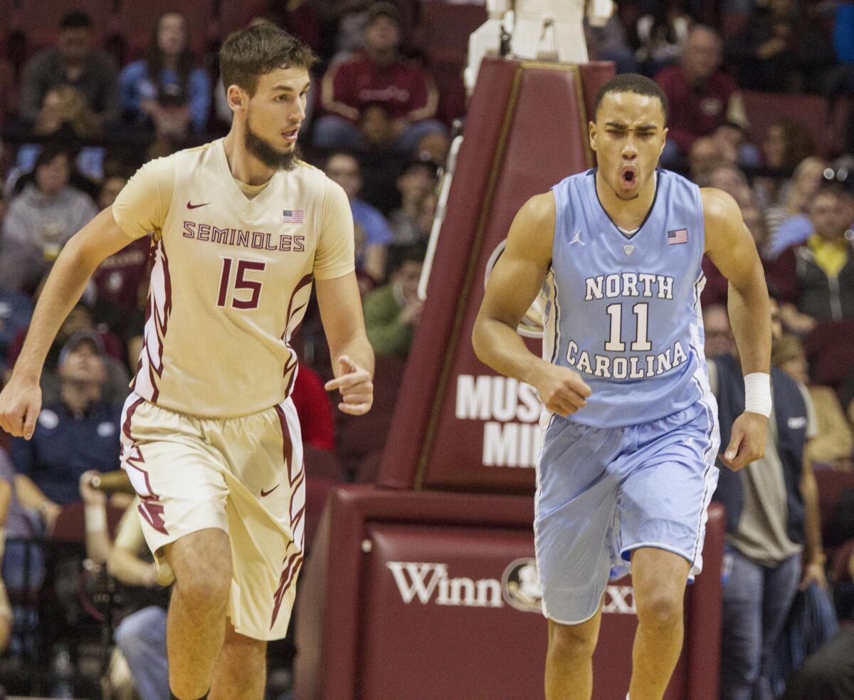 North Carolina forward Brice Johnson (11) reacts after dunking over Florida State center Boris Bojanovsky (15) in the first half. Johnson scored 39 points and had 23 rebounds.