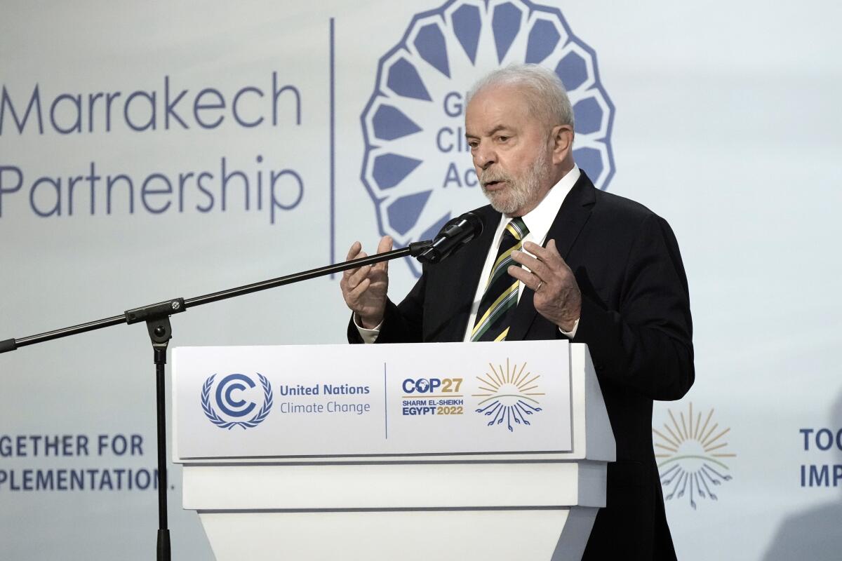 Luiz Inácio Lula da Silva speaks at a lectern.