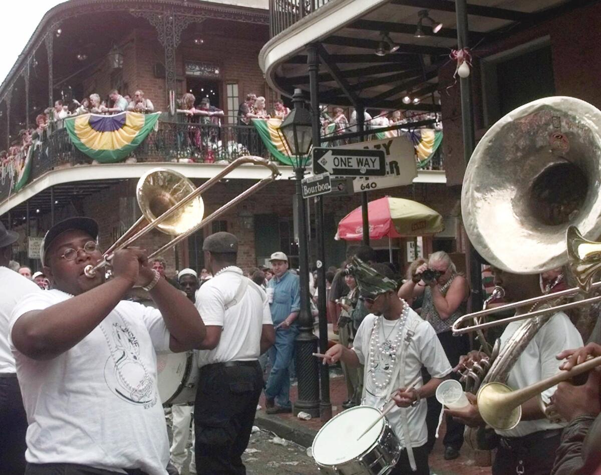 Randall Johnson of the "Cool-Bone Jazz Band" belts out a tune on Bourbon Street.