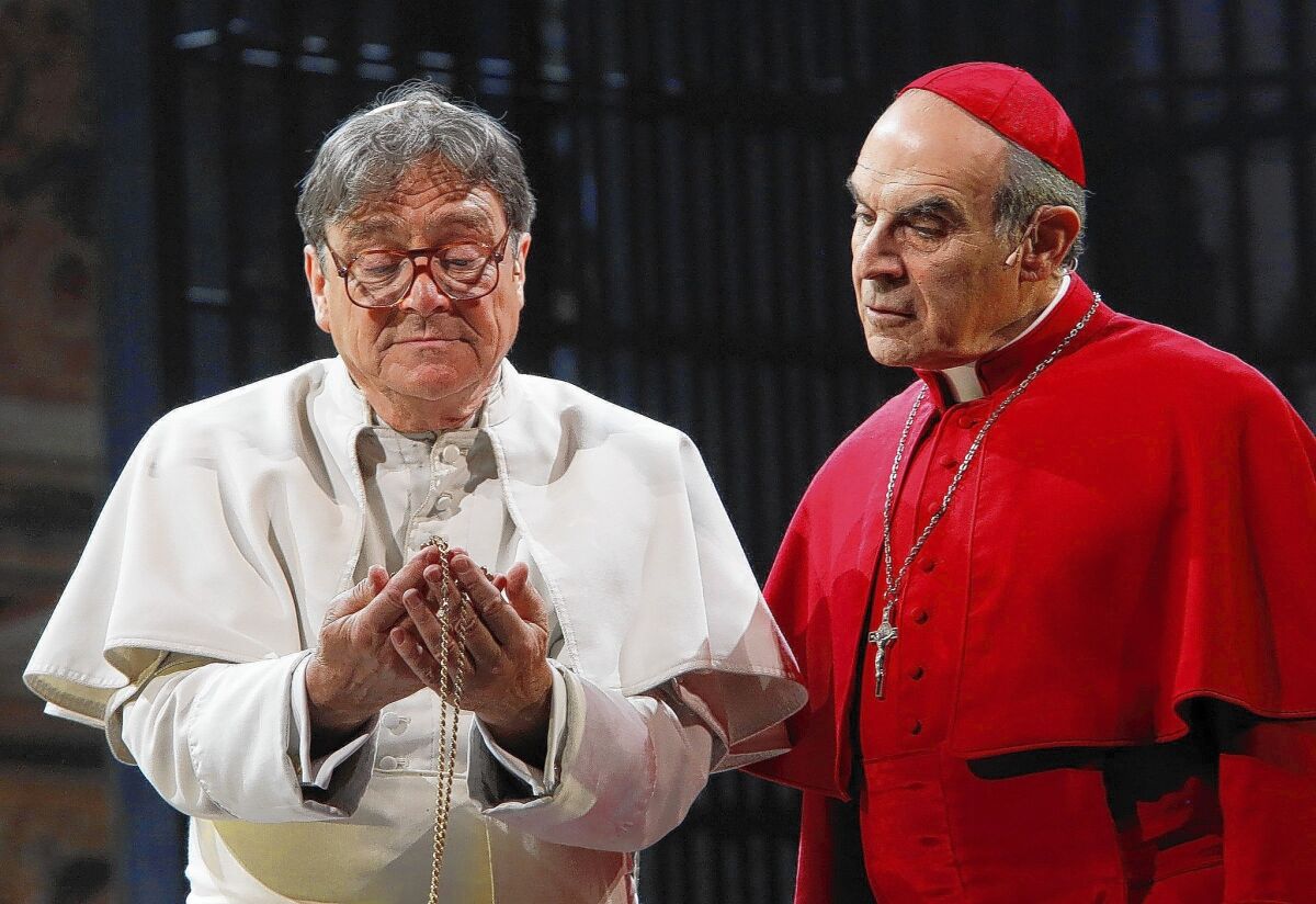 Richard O'Callaghan (Pope John Paul I), left, and David Suchet (Cardinal Giovanni Benelli) in the Center Theater Group's production of "The Last Confession" at the Ahmanson Theatre in Los Angeles.