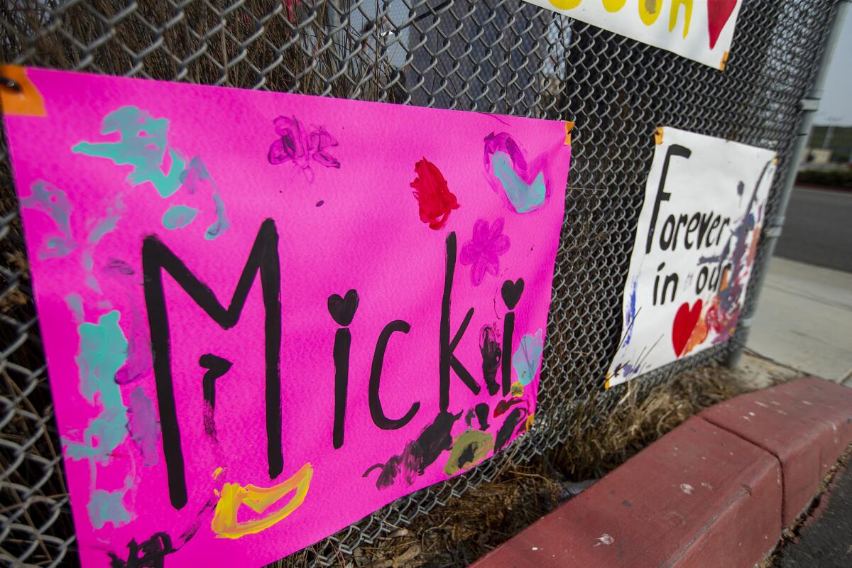 A posters and signs line a fence at Costa Mesa High School for the Nolan Family on Monday, September 14.