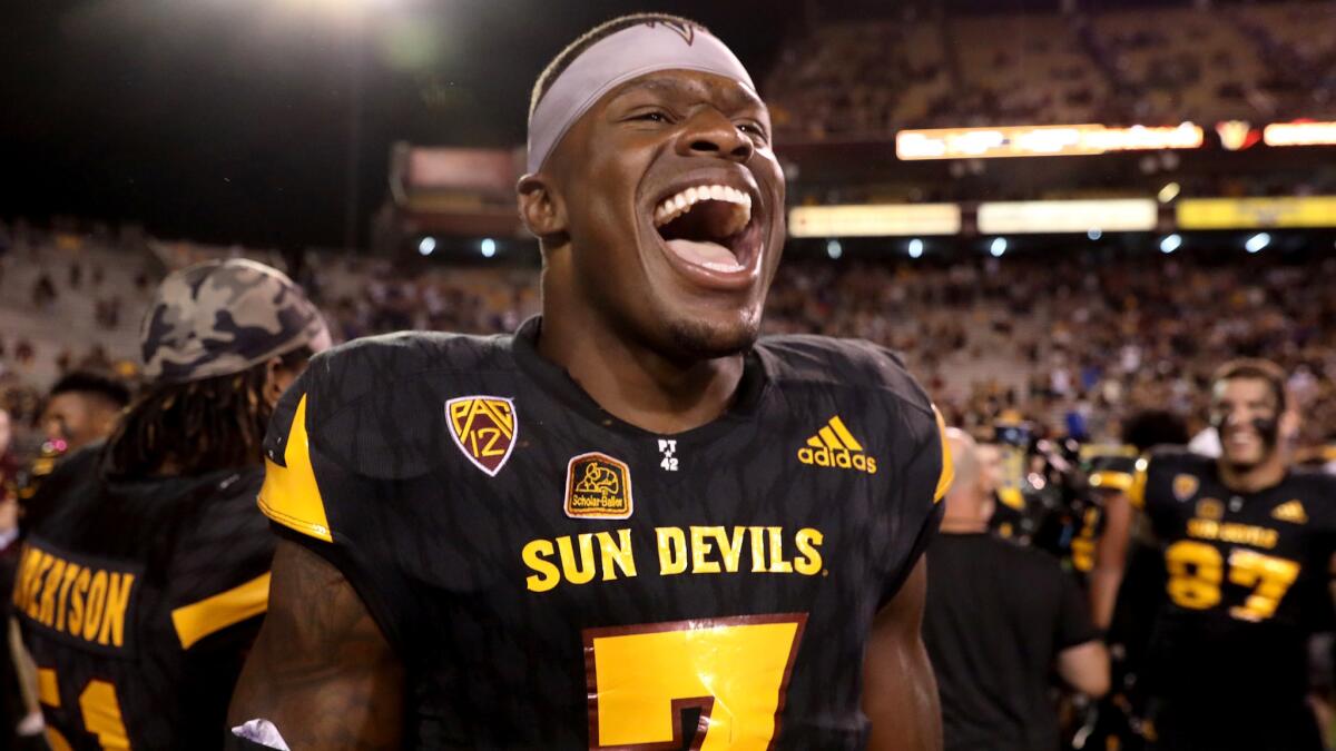 Arizona State running back Kalen Ballage celebrates with teammates after defeating Washington on Saturday night.